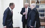 From left, Russia's Foreign Minister Sergei Lavrov, U.S. President Donald Trump, and Russian Ambassador to the United States Sergei Kislyak talk durin