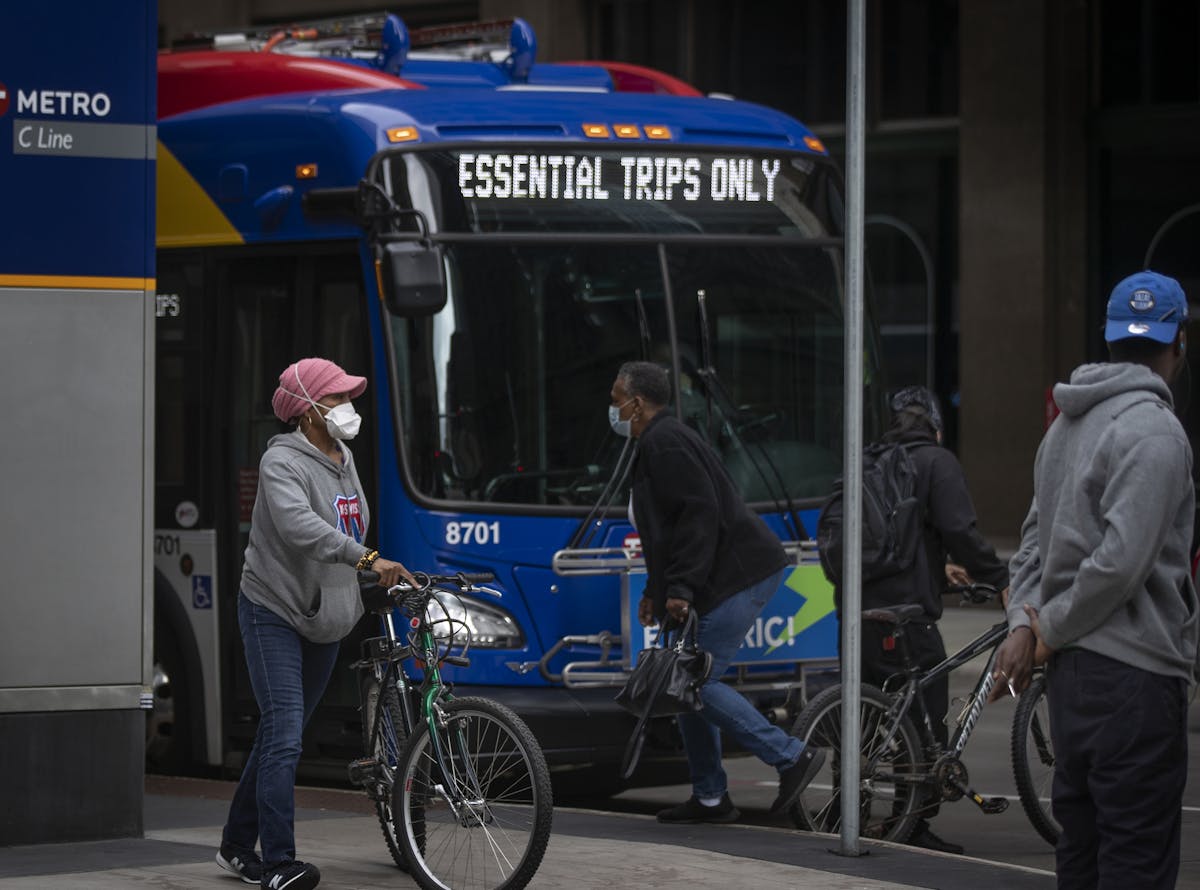 Ebony Yeshua left, waited to board a METRO bus at 8th Street and Nicollet Avenue on Monday morning .] Jerry Holt •Jerry.Holt@startribune.com Face co