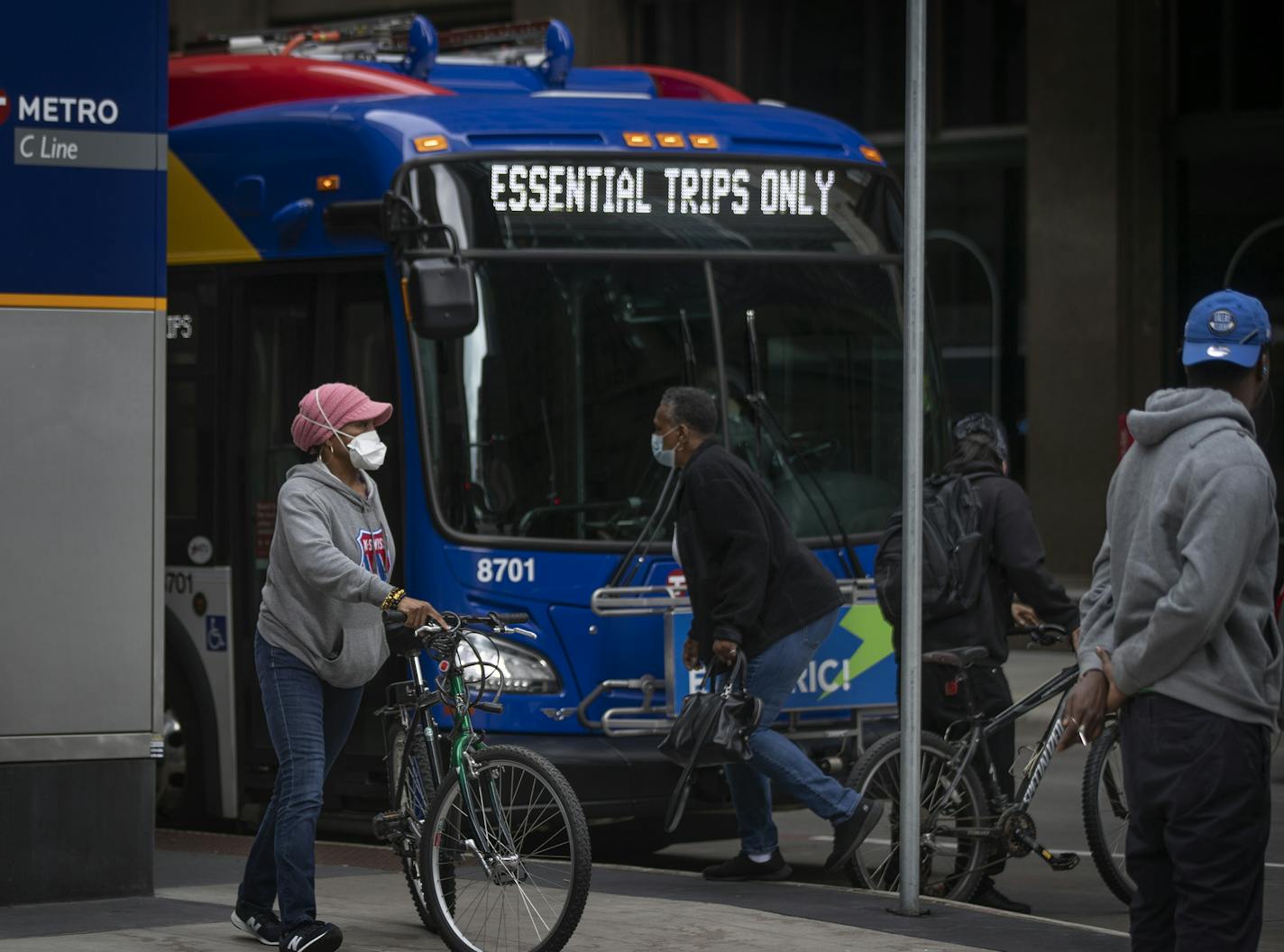 Ebony Yeshua left, waited to board a METRO bus at 8th Street and Nicollet Avenue on Monday morning .] Jerry Holt •Jerry.Holt@startribune.com Face coverings will be required on board all Metro Transit buses and trains Monday May 18, 2020 in Minneapolis , MN.