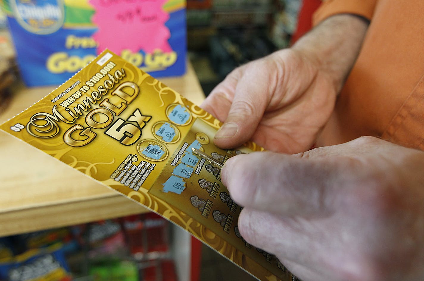 A Clark gas station customer played a scratch card game, Wednesday, May 29, 2013 in St. Paul, MN. (ELIZABETH FLORES/STAR TRIBUNE) ELIZABETH FLORES &#x2022; eflores@startribune.com