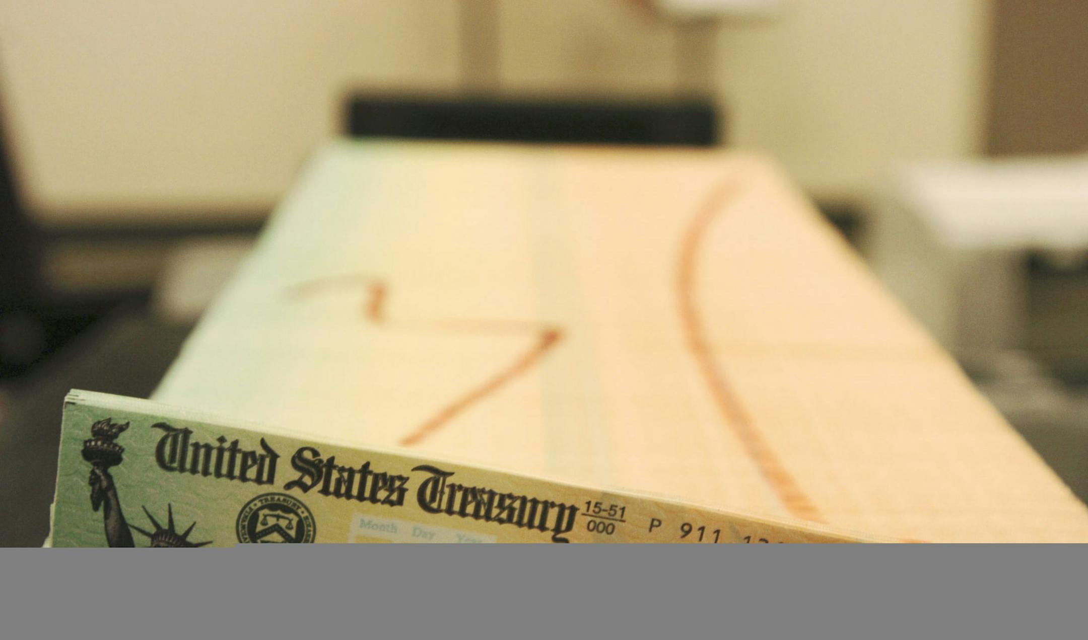 FILE - In this Feb. 11, 2005 file photo, trays of printed social security checks wait to be mailed from the U.S. Treasury's Financial Management services facility in Philadelphia. (AP Photo/Bradley C. Bower, File)