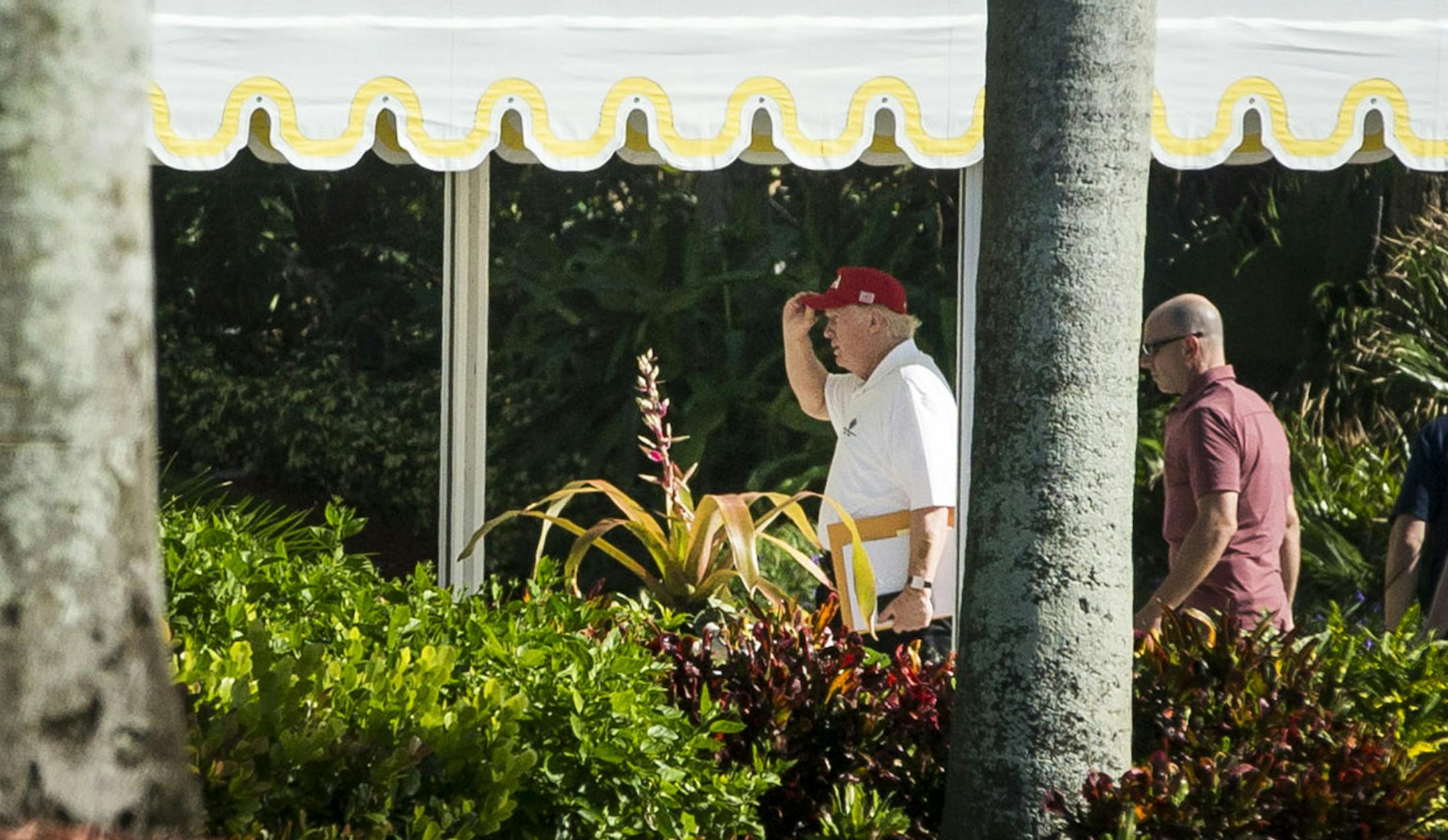 President Donald Trump returns to his Mar-a-Lago club after spending the day at Trump International Golf Club, in Palm Beach, Fla., Nov. 26, 2017. As the Alabama Senate election approaches, the president attacked the Democratic candidate, Doug Jones, as a “Schumer/Pelosi puppet.” (Al Drago/The New York Times)