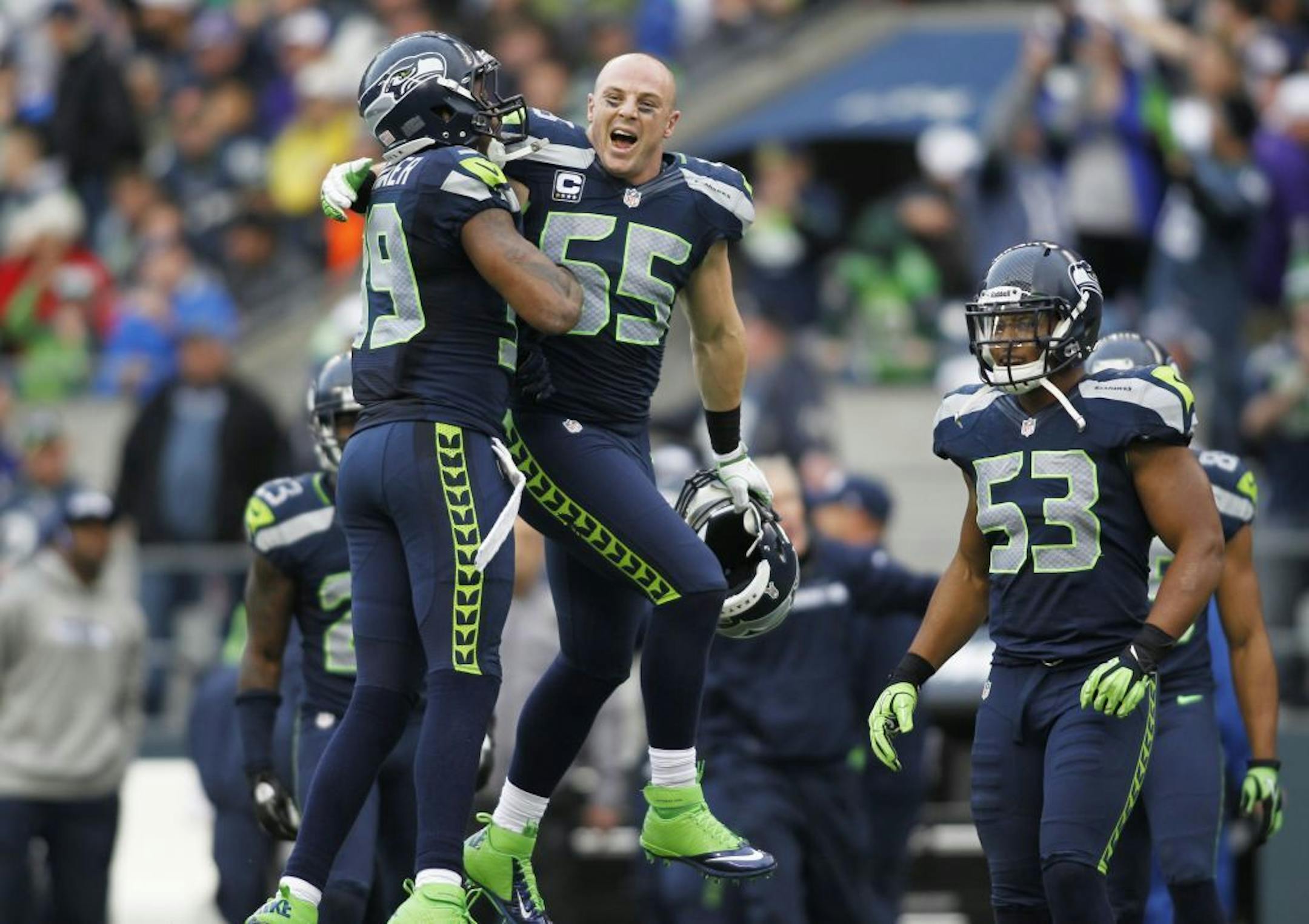 Seattle Seahawks' Heath Farwell (55) and Brandon Browner, left