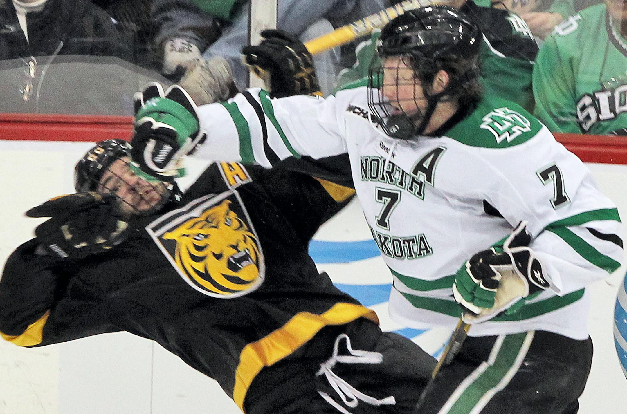WCHA tournament hockey game - University of North Dakota (UND) vs. Colorado College (CC). UND's Danny Kristo, right, sent CC's Eamonn Mcdermott flying with a hard check. (MARLIN LEVISON/STARTRIBUNE(mlevison@startribune.com (cq program)