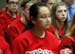 Surrounded by her teammates, Coon Rapids cross-country phenom Bryna DelCastillo, 13, listened to her mother, Sue DelCastillo, address the Anoka Hennep