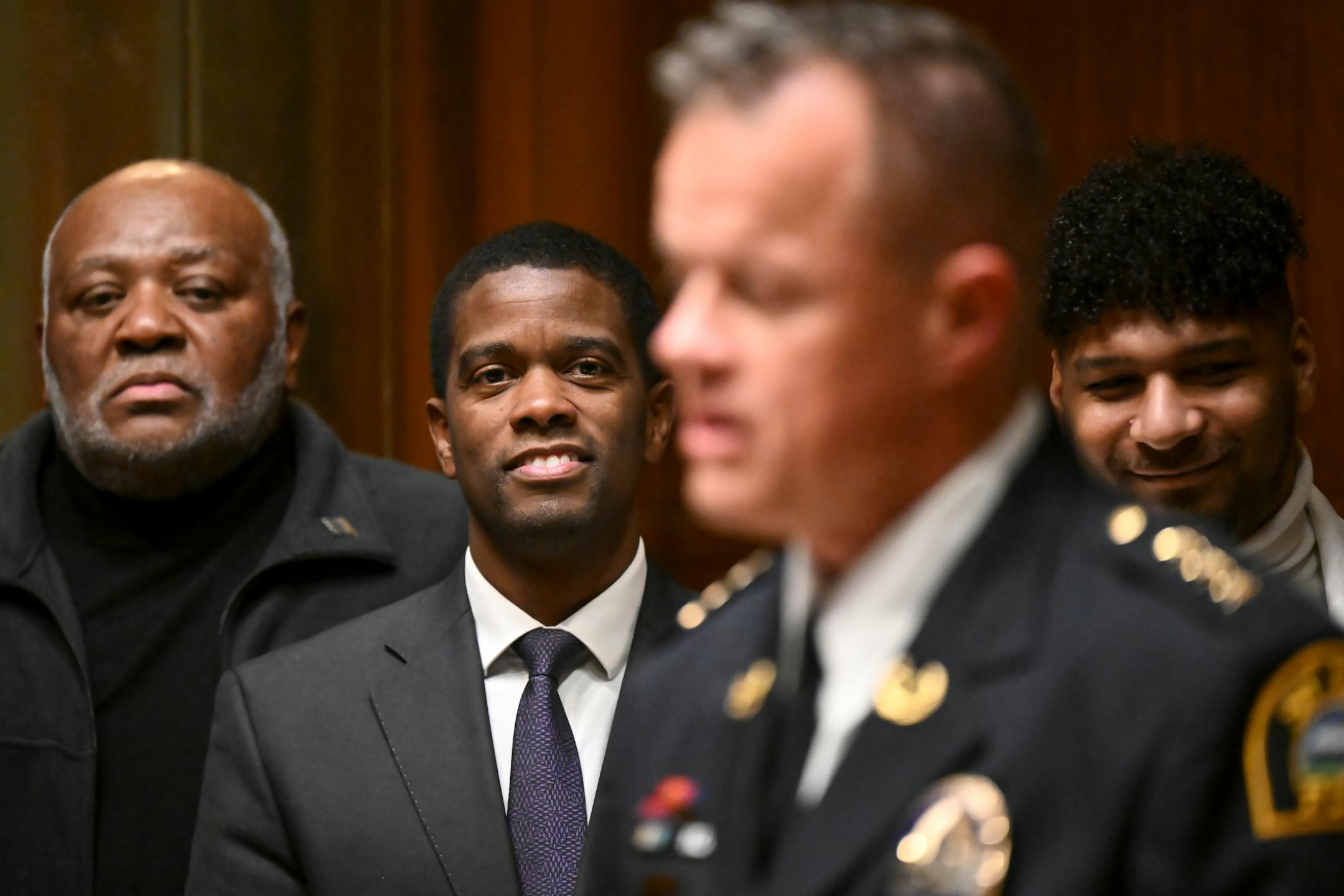St. Paul Mayor Melvin Carter listens as newly sworn-in Police Chief Axel Henry addresses the city council Wednesday, Nov. 16, 2022 at St. Paul City Hall in St. Paul, Minn..