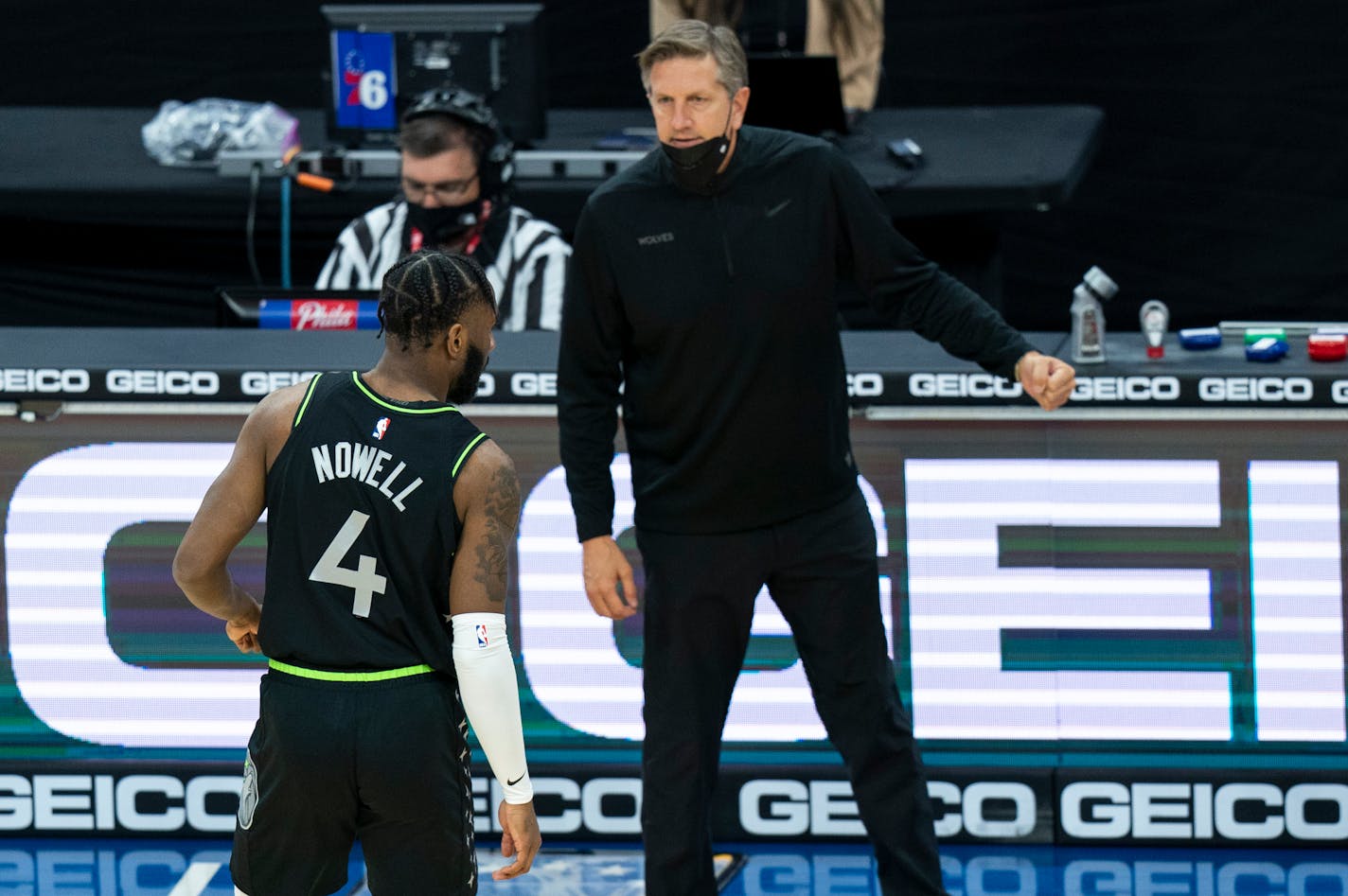 Timberwolves coach Chris Finch talks with Jaylen Nowell during the first half of a game last month.