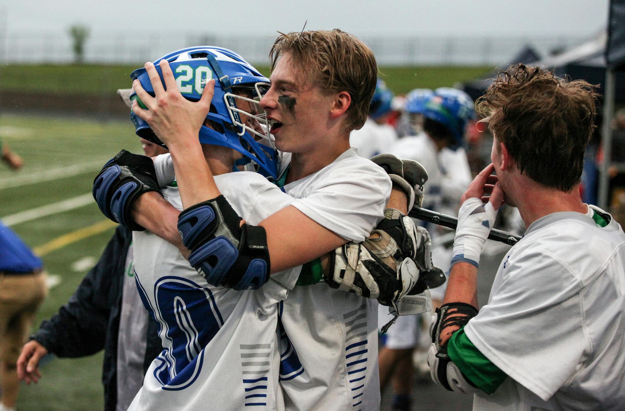 Eagan Owen Pixler (48) and Aaron Propson (20) hugged to cheer during a time out in the forth quarter. ] XAVIER WANG • xavier.wtian@gmail.com Game action from the 2017 Boys and Girls State Lacrosse Tournament Boys' final game between Benilde-St. Margaret's and Eagan on Saturday June 17, 2017 at Chanhassen High School.