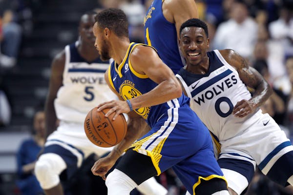The Warriors' Stephen Curry drove past the Timberwolves' Jeff Teague during their preseason NBA game in Shanghai, China.