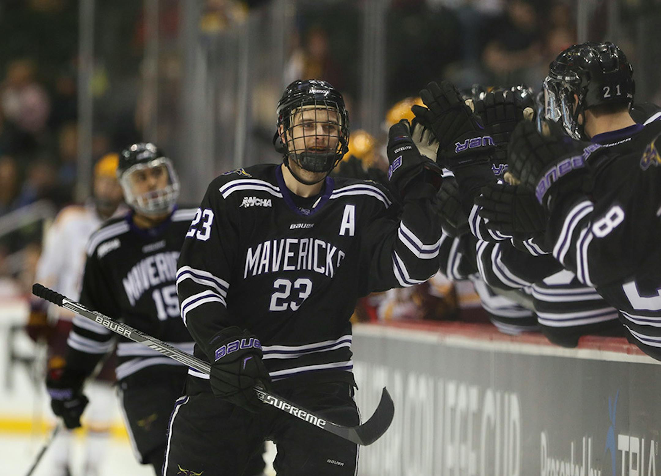 Mavericks forward Teddy Blueger (23) celebrated his game-winning goal with the Mankato bench in the third period Sunday afternoon.