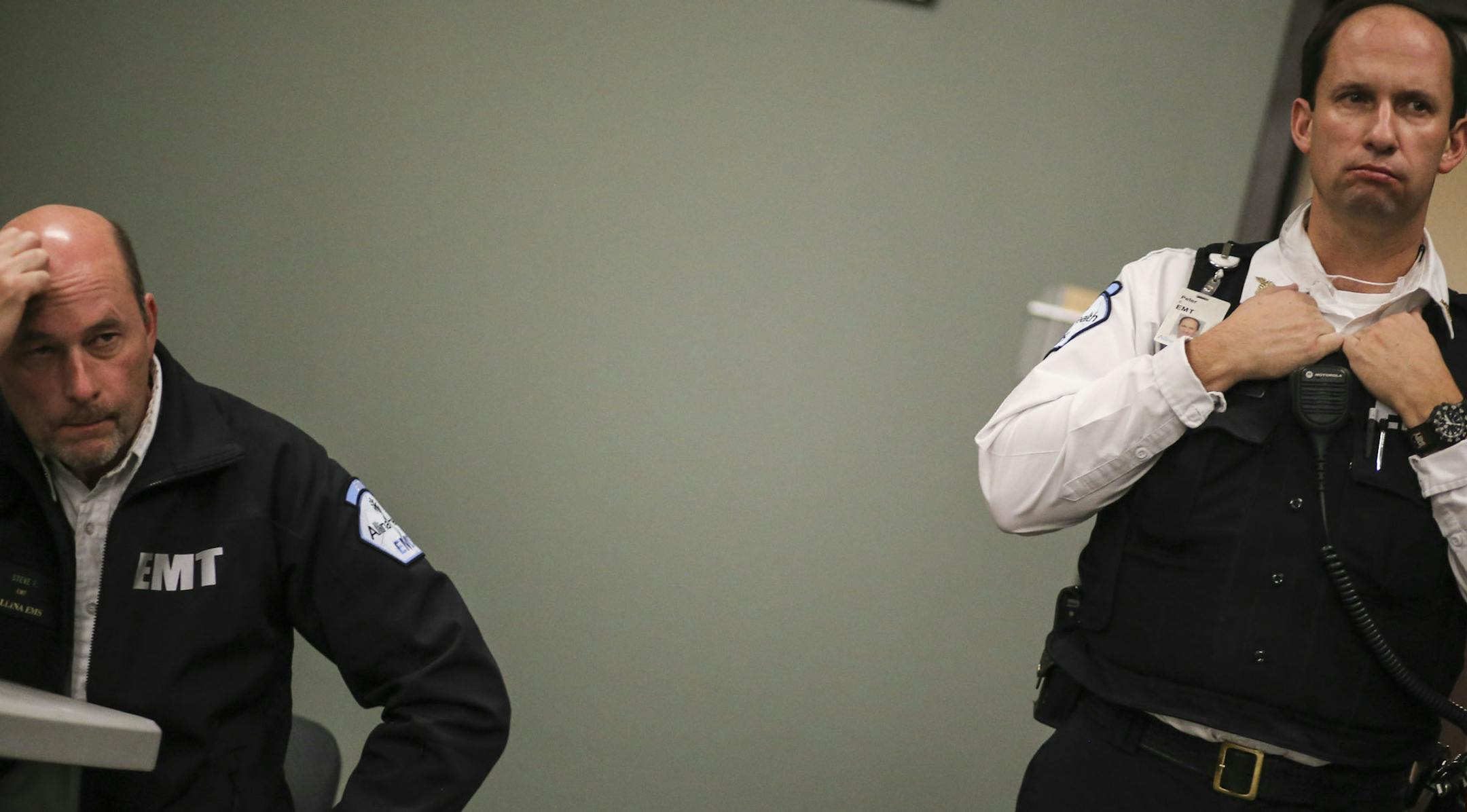 Allina EMS first responders received training on the latest protocol for handling future patients possibly infected with Ebola Tuesday, Oct. 28, in Mounds View, MN. Here, Steve Petty, left, and Pete Cheolis, both Allina EMT's, listen to a manager talk about Ebola safety protocol. ](DAVID JOLES/STARTRIBUNE)djoles@startribune.com As national, state and local leaders debate quarantines and other more aggressive measures to combat Ebola, Hennepin County first responders have quietly introduced new p