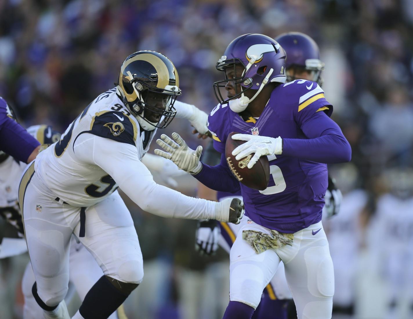 Vikings quarterback Teddy Bridgewater (5) was pursued by Rams defensive end William Hayes (95).