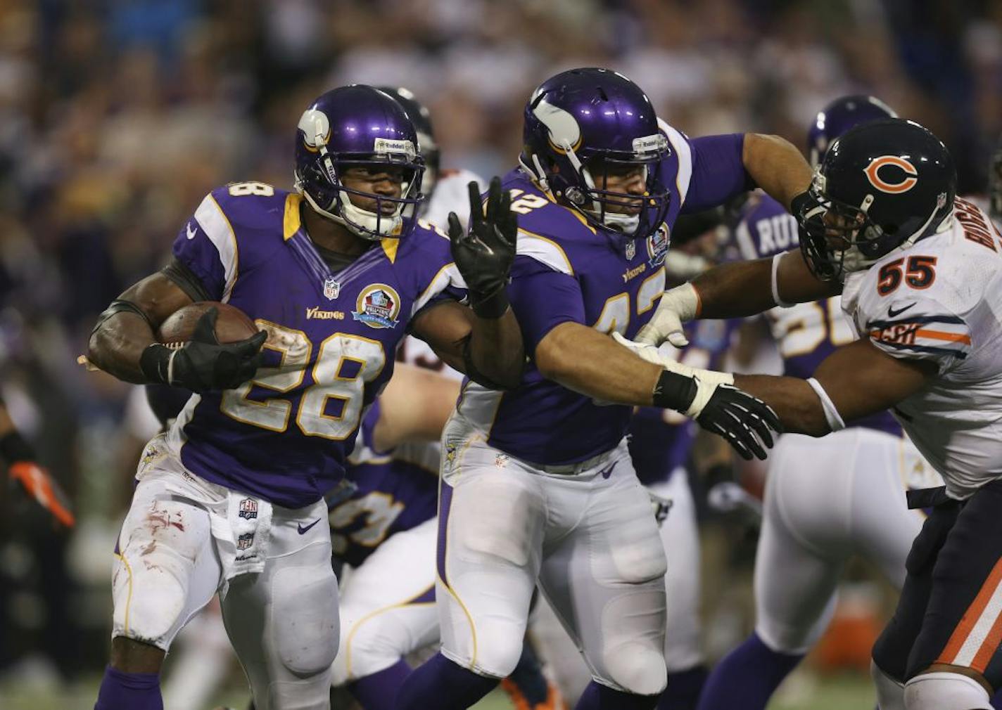 Adrian Peterson followed Jerome Felton's block against the Bears in December. The Bears and Vikings play in Week 2 at Chicago and Week 13 at the Metrodome.