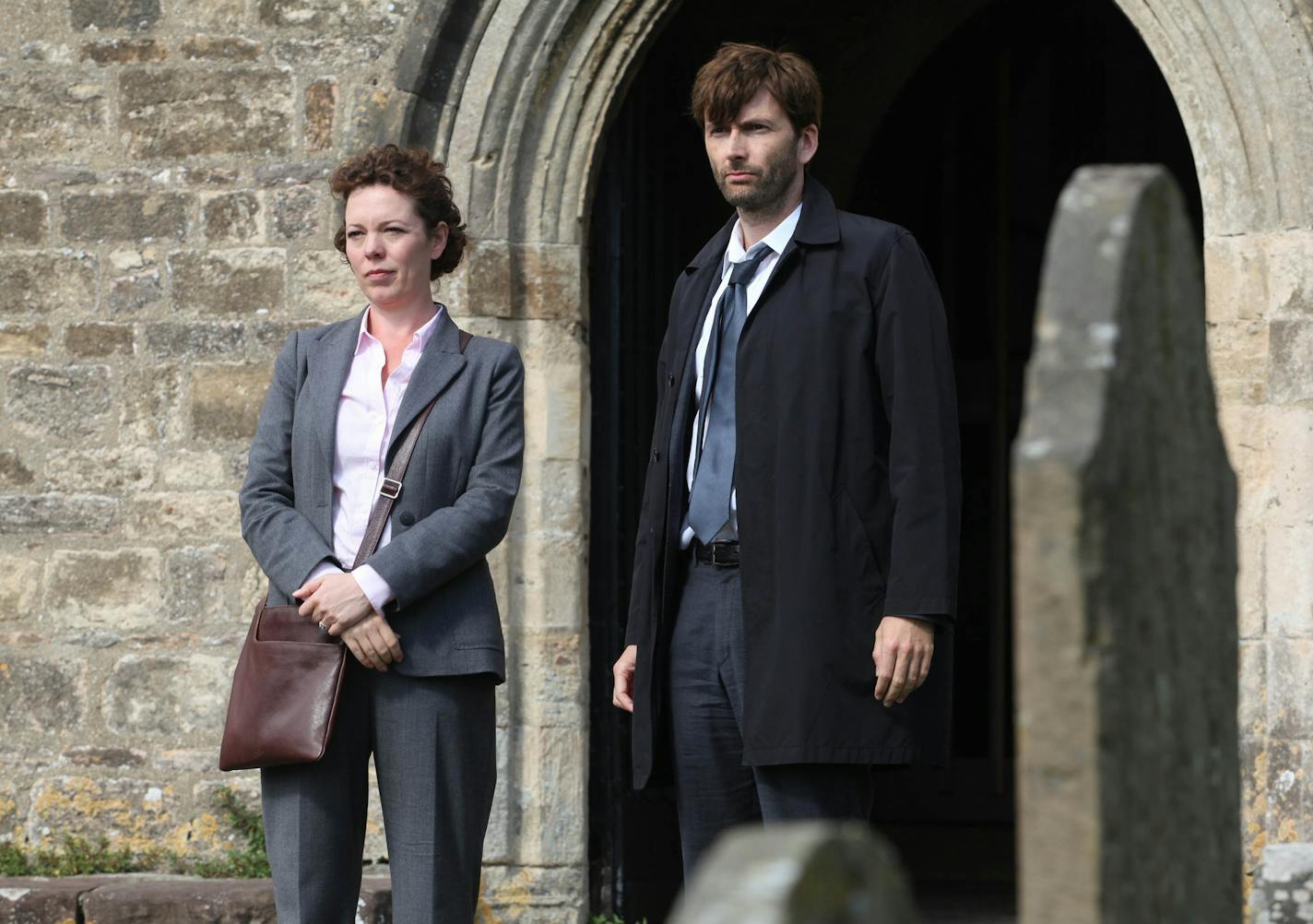 This publicity image released by BBC America shows David Tennant as Alec Hardy, right, and Olivia Coleman as Ellie Miller, from the series "Broadchurch," premiering Aug. 7 at 10 p.m. EST. (AP Photo/BBC America, Patrick Redmond) ORG XMIT: MIN2013073115043058