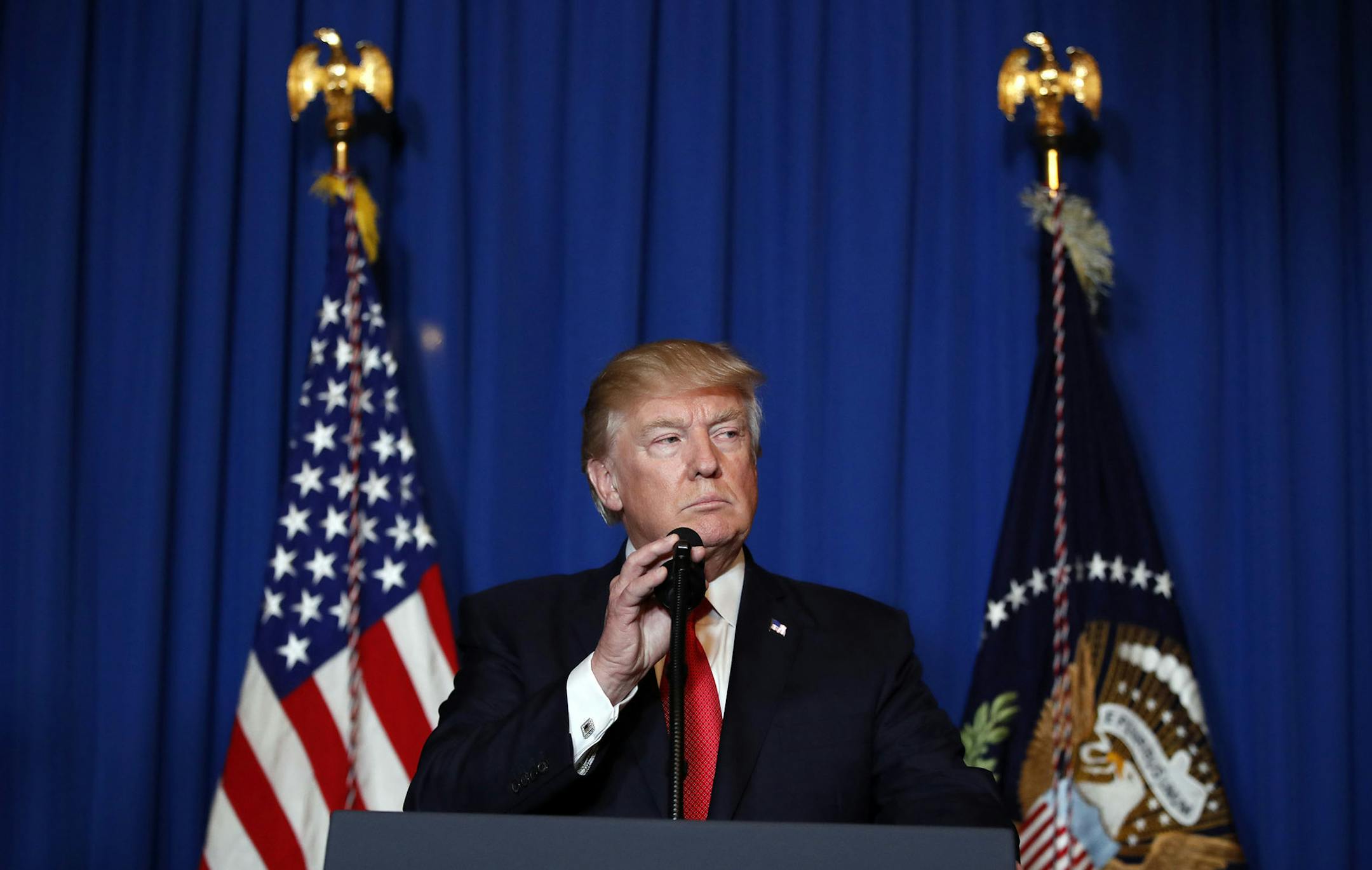 President Donald Trump speaks at Mar-a-Lago in Palm Beach, Fla., Thursday, April 6, 2017, after the U.S. fired a barrage of cruise missiles into Syria Thursday night in retaliation for this week's gruesome chemical weapons attack against civilians. (AP Photo/Alex Brandon) ORG XMIT: MIN2017040621394697