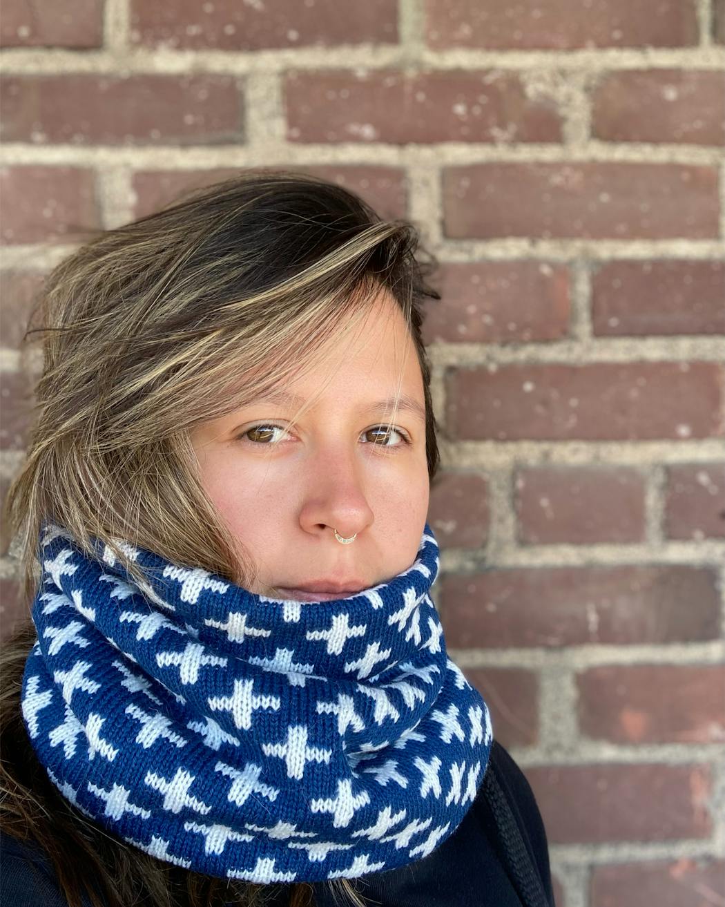 Textile artist and designer Maggie Thompson, who launched Makwa Studio, knits cowls and winter hats that incorporate subtle influences from regalia and beadwork.