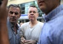 In this July 25, 2018 photo, Andrew Craig Brunson, an evangelical pastor from Black Mountain, North Carolina, arrives at his house in Izmir, Turkey. A