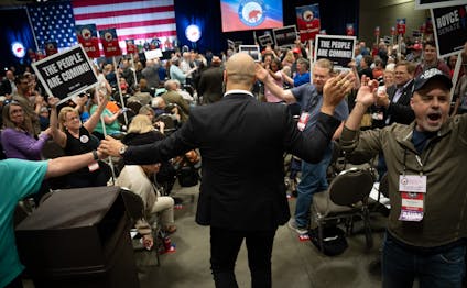 Royce White high-fives supporters at the GOP convention after winning the endorsement May 18 in St. Paul.