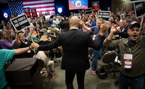 Royce White high-fives supporters at the GOP convention after winning the endorsement May 18 in St. Paul.