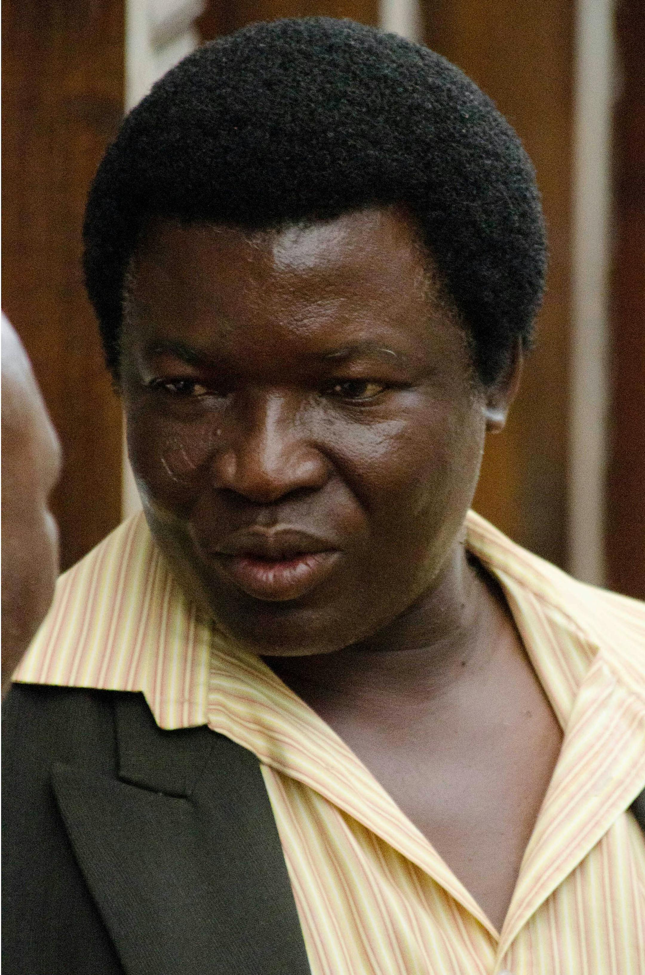 Farm owner Honest Trymore Ndlovu appears at Hwange magistrates' court to face poaching charges, about 435 miles (700 kilometers) west of the capital Harare, Wednesday, July, 29, 2015. Ndlovu and his co-defendant, professional hunter Theo Bronkhorst , are accused of helping Walter James Palmer hunt the lion. Zimbabwean police said they are looking for Palmer, the American dentist who reportedly paid $50,000 to track and kill the animal. (AP Photo)