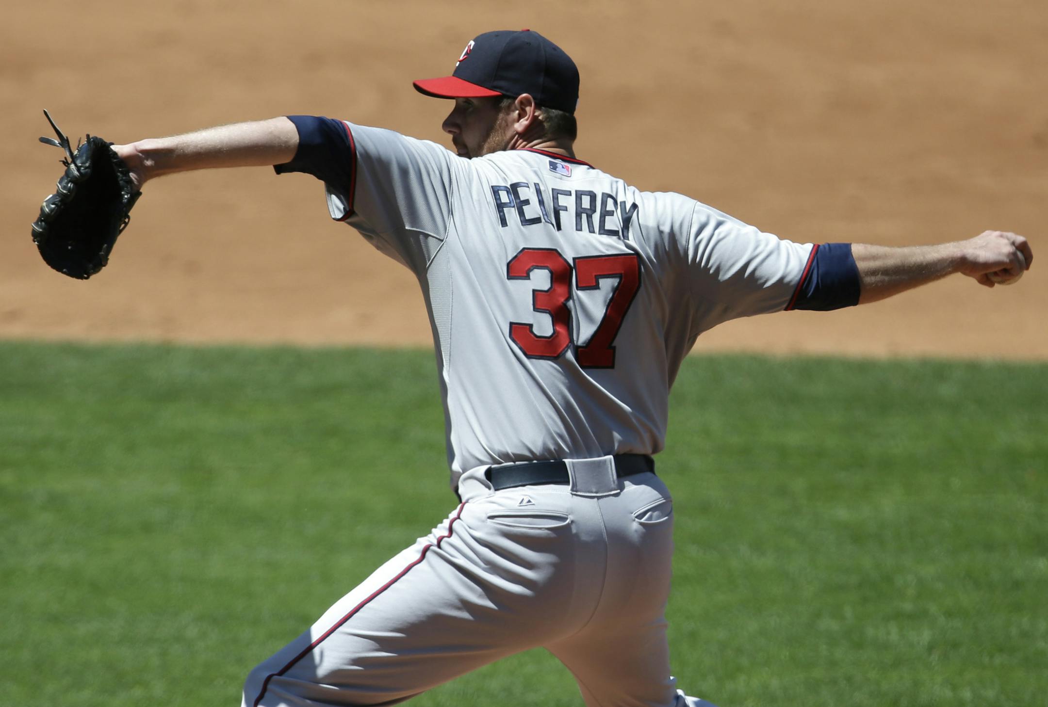 Minnesota Twins starting pitcher Mike Pelfrey pitches against the Cleveland Indians in a baseball game, Sunday, May 5, 2013, in Cleveland. (AP Photo/Tony Dejak)