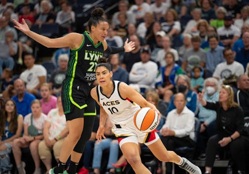 Las Vegas Aces guard Kelsey Plum (10) drove against the defense of Minnesota Lynx forward Kayla McBride (21) in the first quarter.