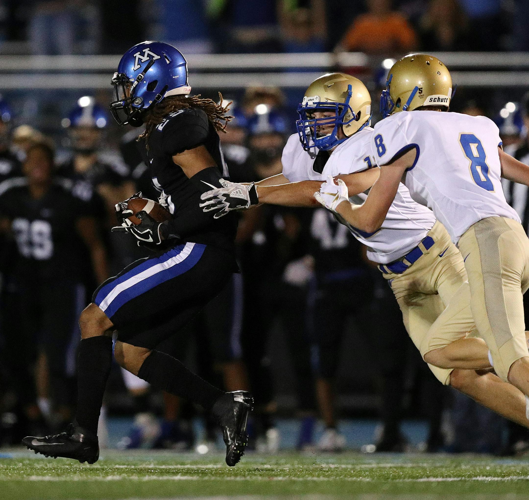 Wayzata High School wide receiver Jacob Wildermuth (12) tried to chase down Minnetonka High School cornerback Raheem Brown (25) after he intercepted a Wayzata High School pass late in the second half. ] ANTHONY SOUFFLE &#xef; anthony.souffle@startribune.com Minnetonka High School played Wayzata High School in an MSHSL football game Friday, Sept. 7, 2018 at Minnetonka High School in Minnetonka, Minn.