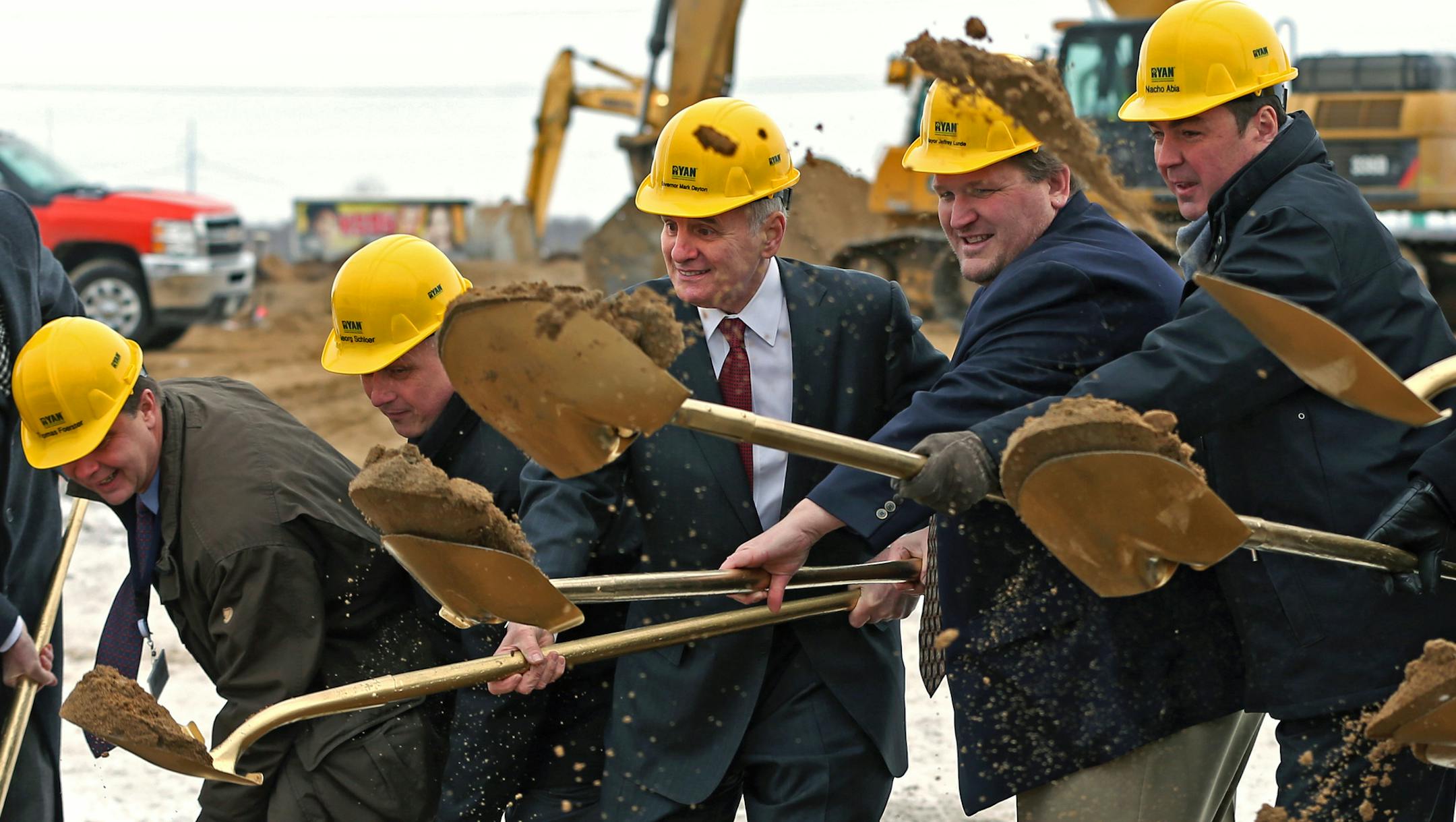 (left to right) Thomas Foerster, from Olympus, Georg Schloer, from Olympus, Governor Mark Dayton, Jeffrey Lunde, Brooklyn Park Mayor and Nacho Abia of Olympus joined other representatives from the City of Brooklyn Park, Ryan Companies, Jones Lang LaSalle, Olympus Surgical Technologies America and Olympus Corporation of America in the ground breaking ceremony on 12/13/13, for a new 100,000 square-foot research, development, and manufacturing facility for Olympus Surgical Technologies America in B