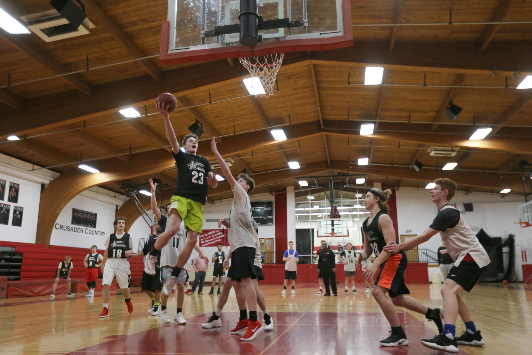 Junior Baden Noennig, the Crusaders' leading scorer, jumps for a dunk during a practice.