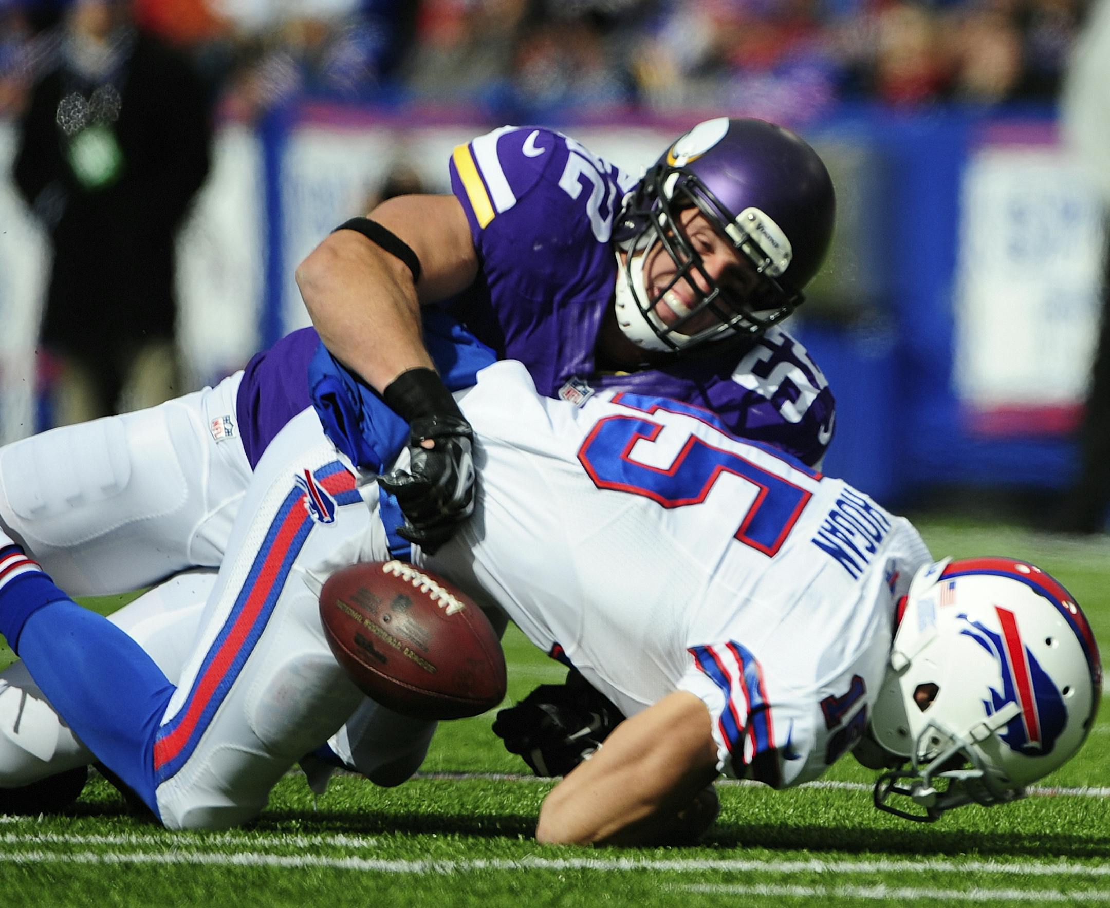 Buffalo Bills wide receiver Chris Hogan (15) fumbles the ball as he is tackled by Minnesota Vikings' Chad Greenway (52) during the first half of an NFL football game Sunday, Oct. 19, 2014, in Orchard Park, N.Y. (AP Photo/Gary Wiepert) ORG XMIT: MIN2014101913215611