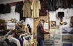Store manager Matt Johnson went through a bin of donations at Steeple People thrift store on Thursday, December 1, 2016, in MInneapolis, Minn. Steeple