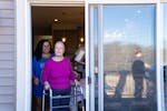 Myah Gray and her grandmother Nancy Uden step outside for some fresh air during a 73rd birthday celebration for Uden in April at her home in Corcoran.