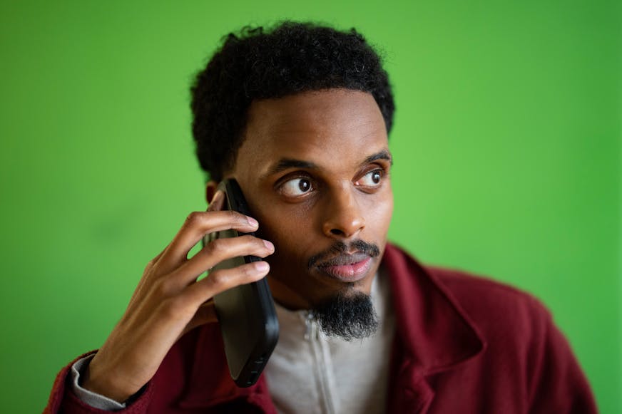 Minnesota DFL State Senator Omar Fateh calls friends and family members to tell them he intends to run for mayor of Minneapolis at Hosmer Library in Minneapolis, Minn. on Tuesday, Nov. 26, 2024