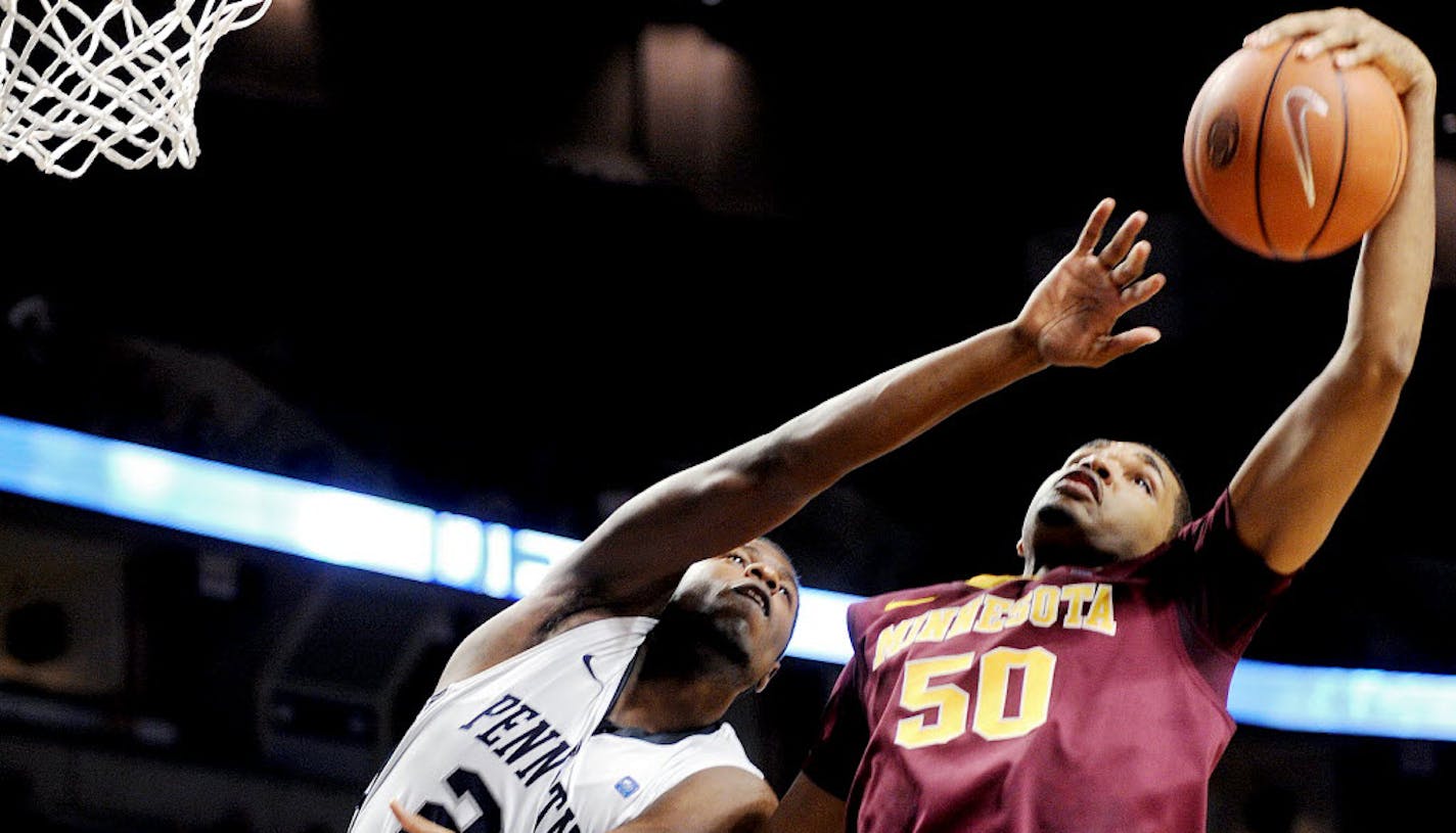 Minnesota's Ralph Sampson III grabs the rebound over Penn State's Jon Graham.