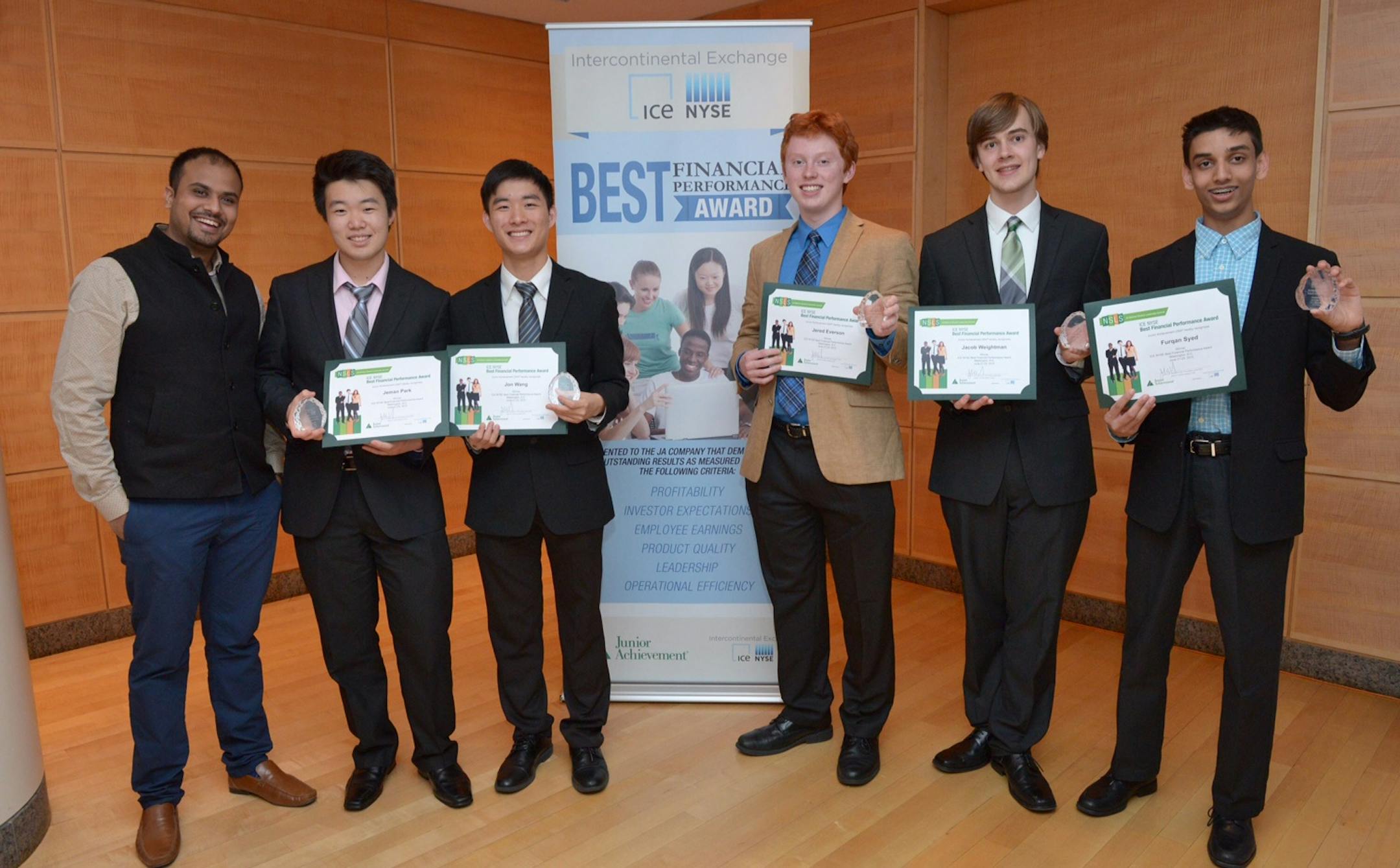 Five Mounds View High School students last week competed against 14 other teams in entrepreneurship at the Junior Achiement National Student Leadership Summit in Washington D.C. Their student-run company, "Mustang Mail," won the Best Financial Performance Award for leadership, profitability, employee earnings and other criteria. Mustang Mail is a personalized card company that provides in-person delivery. Pictured (left-to-right) are JA volunteer Ishan Jaithwa of Cummins Power Systems, and Mound