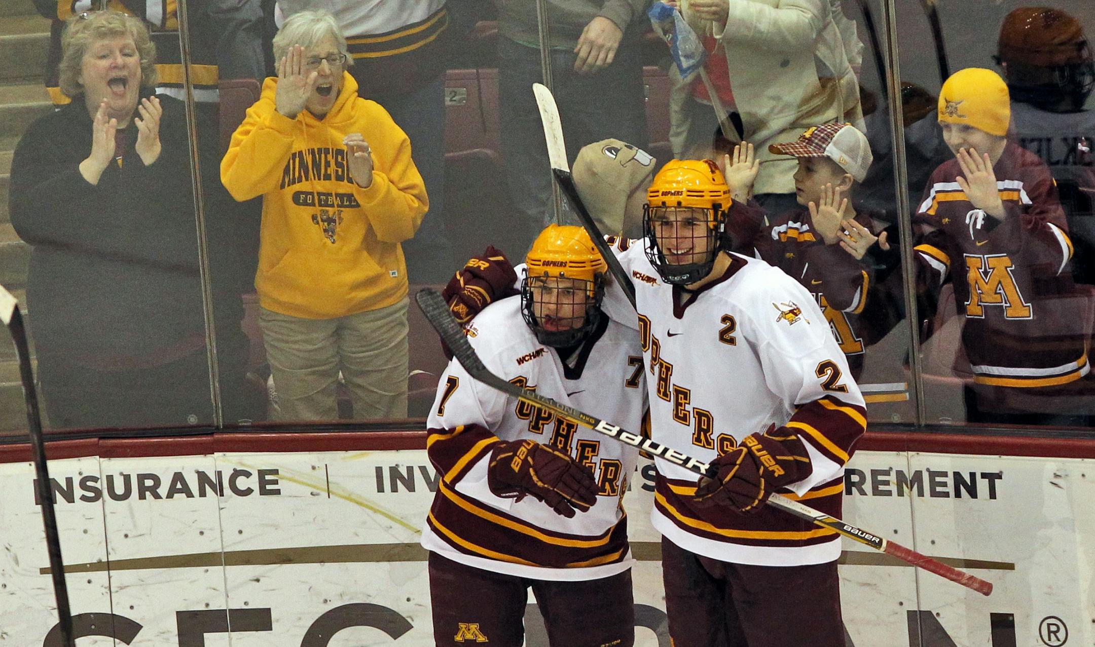 Minnesota Gophers vs. Alaska Anchorage Seawolfs. Gophers fans joined players Kyle Rau, left, and Brady Skjei after Rau scored a goal in the 2nd period. (MARLIN LEVISON/STARTRIBUNE(mlevison@startribune.com