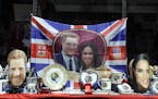Merchandise is displayed for sale in a shop window in Windsor, England, Monday, May 14, 2018. Preparations are being made in the town ahead of the wed
