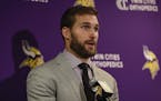 Minnesota Vikings quarterback Kirk Cousins (8) answers questions during a news conference after an NFL football game against the New York Giants, Sund