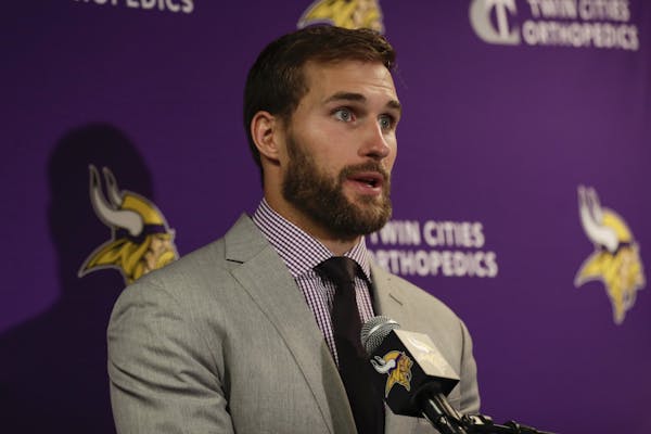Minnesota Vikings quarterback Kirk Cousins (8) answers questions during a news conference after an NFL football game against the New York Giants, Sund