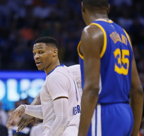 Thunder guard Russell Westbrook, left, and Warriors forward Kevin Durant &#x2014; teammates once, now with different support.