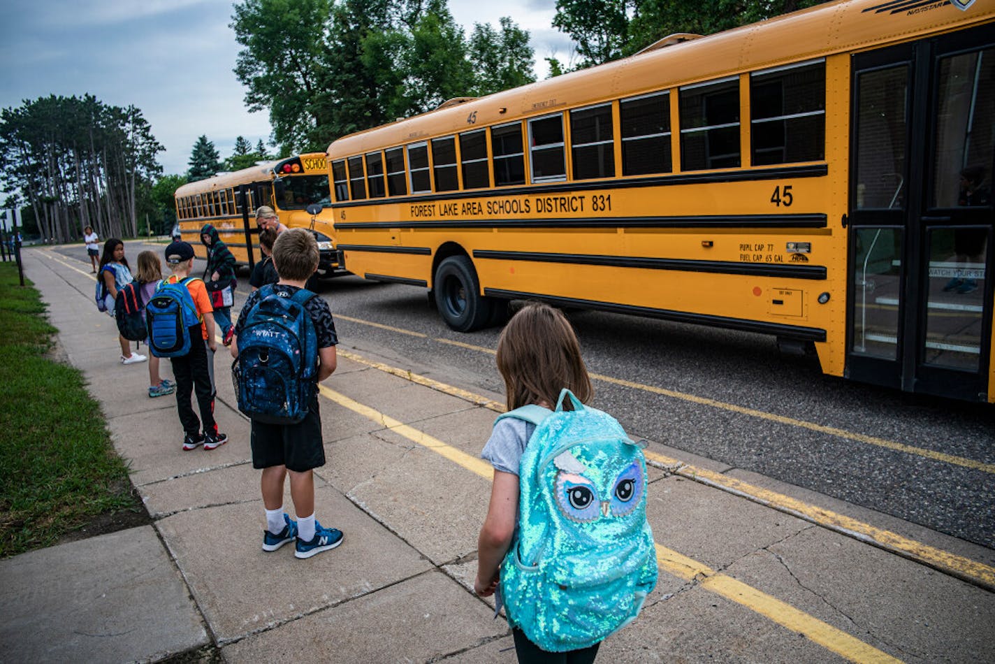 Children arrive for classes at Forest View Elementary where social distancing is enforced. In what could be a preview of things to come this fall, a small number of Minnesota school districts and charter schools are using a "hybrid" instruction model.