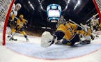 Nashville Predators goalie Pekka Rinne (35), of Finland, reaches to make a stop against the Pittsburgh PenguinsGame 3 of the NHL hockey Stanley Cup Fi