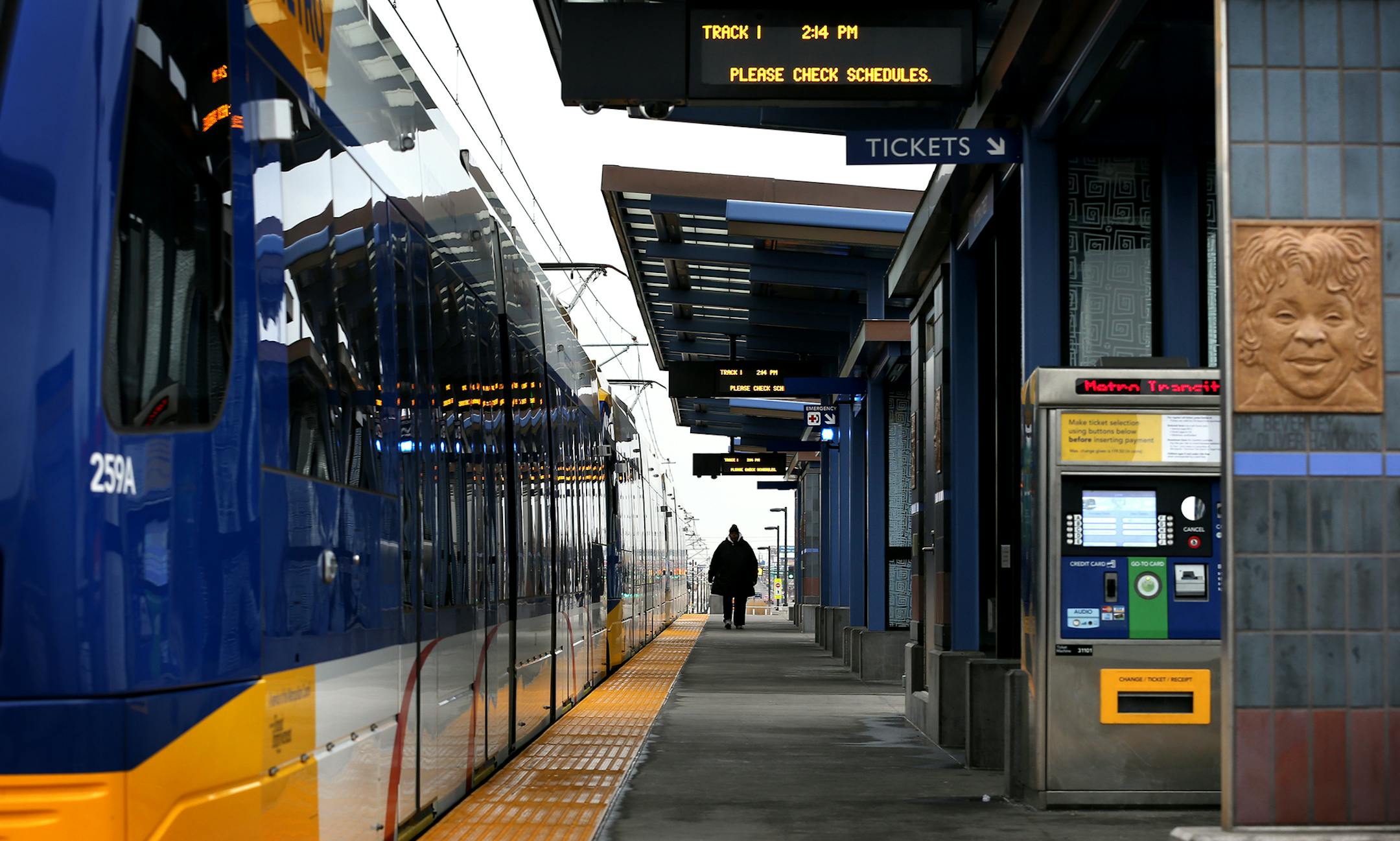 A passenger walks on the platform of Metro Green Line's westbound Victoria Street station in St. Paul on Monday, December 8, 2014. ] LEILA NAVIDI leila.navidi@startribune.com /