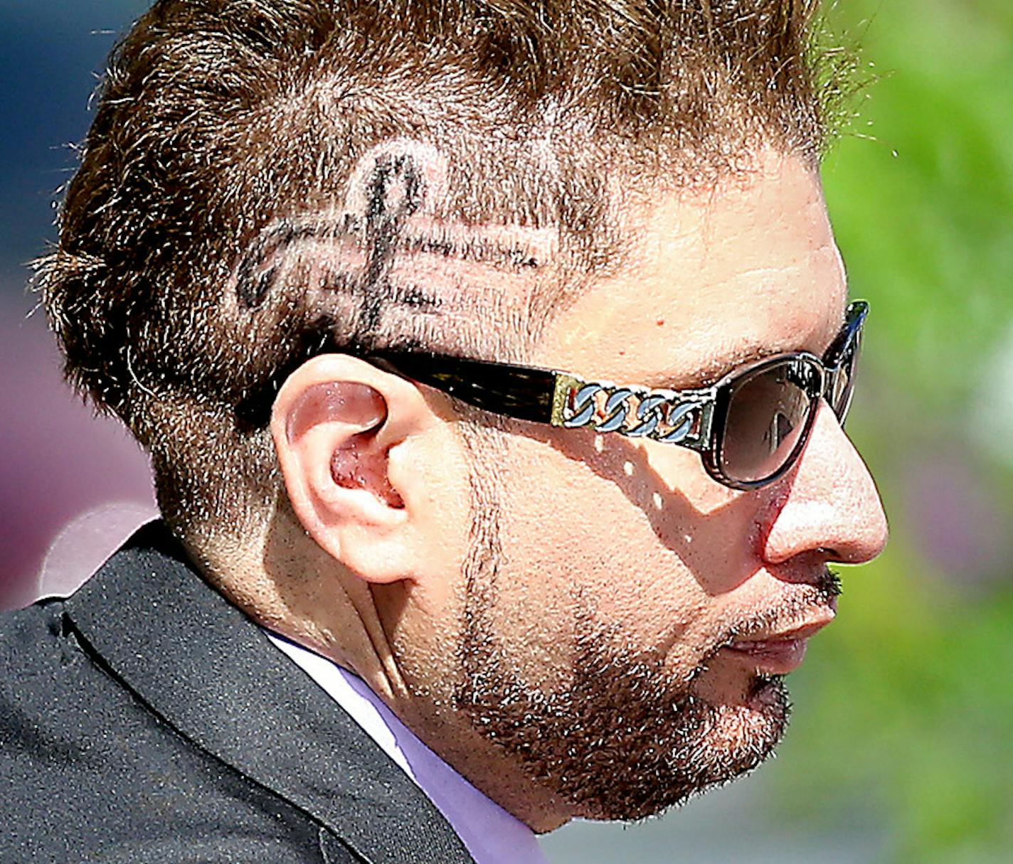 With a Prince sign shaved on his head, Prince's half-brother Omarr Baker left the Carver County Justice Center on June 27, 2016 in Chaska, MN. Attorneys representing the potential heirs to Prince's estate met in court to discuss issues related to DNA testing of those making a claim to the late musician's music and millions. ] (ELIZABETH FLORES/STAR TRIBUNE) ELIZABETH FLORES &#x2022; eflores@startribune.com