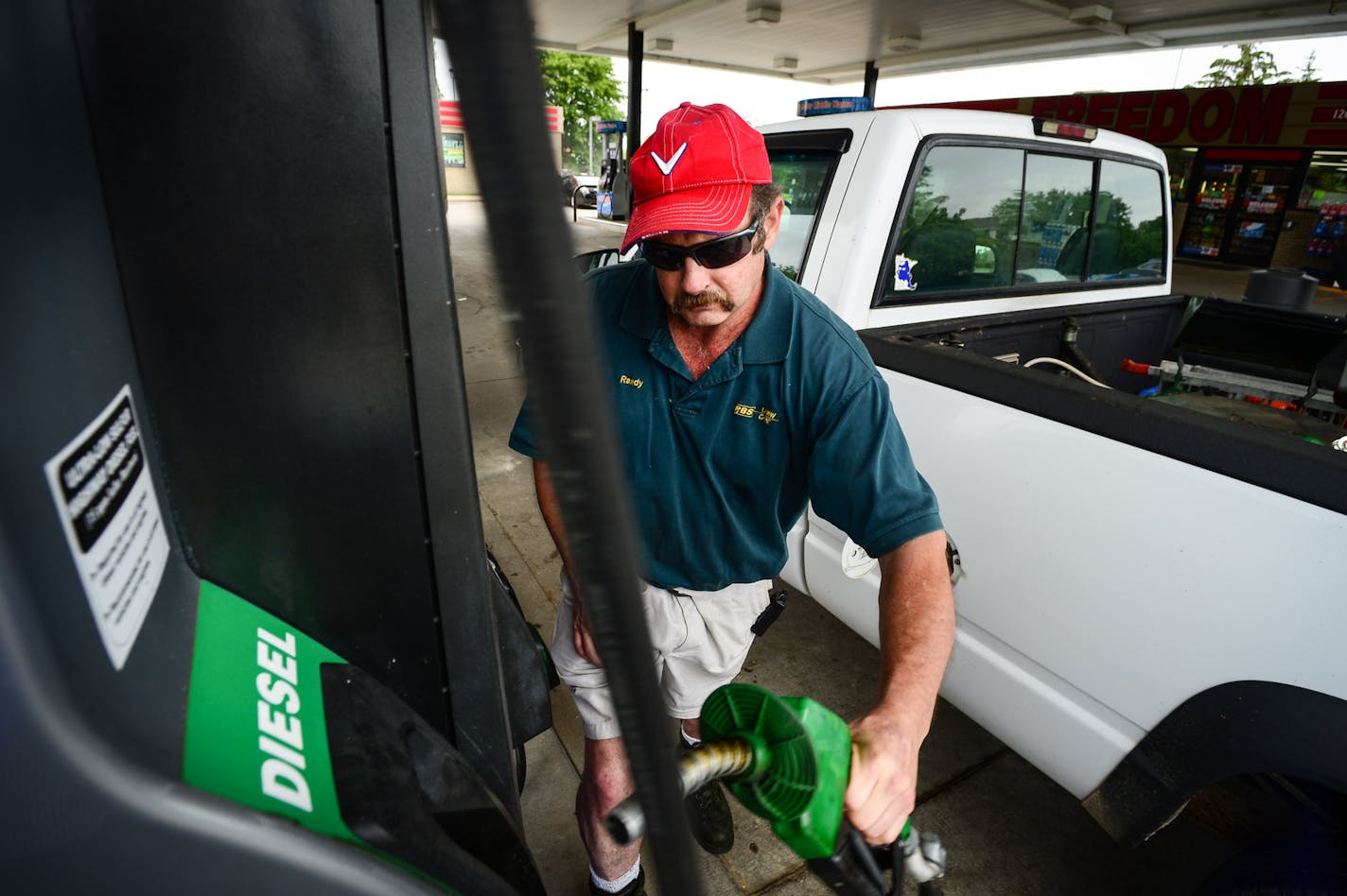 Randy Baudler filled up his RBS Lawn Care pickup truck with diesel fuel at Freedom Valu Center in Plymouth. He has had trouble with diesel fuel gumming up in cold weather and is not looking forward to the changes, which could make things worse.