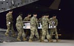 In a photo provided by the U.S. Air Force, the remains of Staff Sgt. Dustin Wright, one of four American soldiers killed in a firefight in Niger, is r