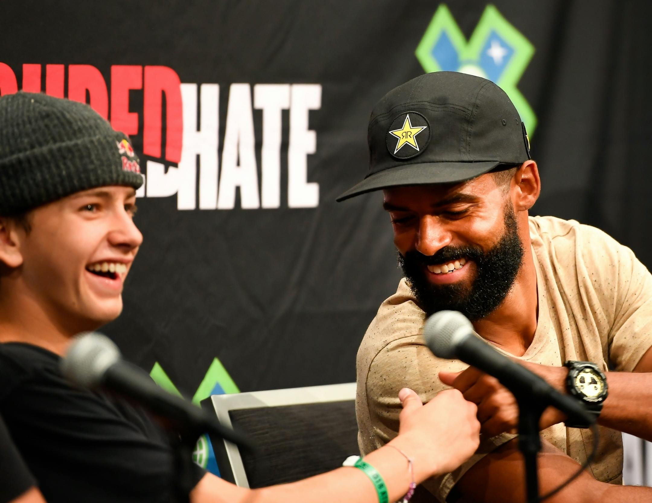 BMX rider Mykel Larrin, of Racine, Wisconsin, bumped fists with 17-year old park and street skateboarder Jagger Eaton, of Mesa, Arizona, during Wednesday's athletes panel at US Bank Stadium.