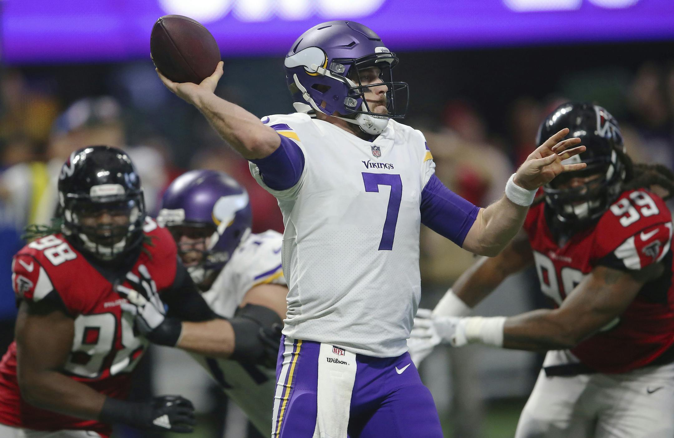 Minnesota Vikings quarterback Case Keenum (7) works under pressure from Atlanta Falcons defensive end Adrian Clayborn (99) during the second half of an NFL football game, Sunday, Dec. 3, 2017, in Atlanta. (AP Photo/John Bazemore)
