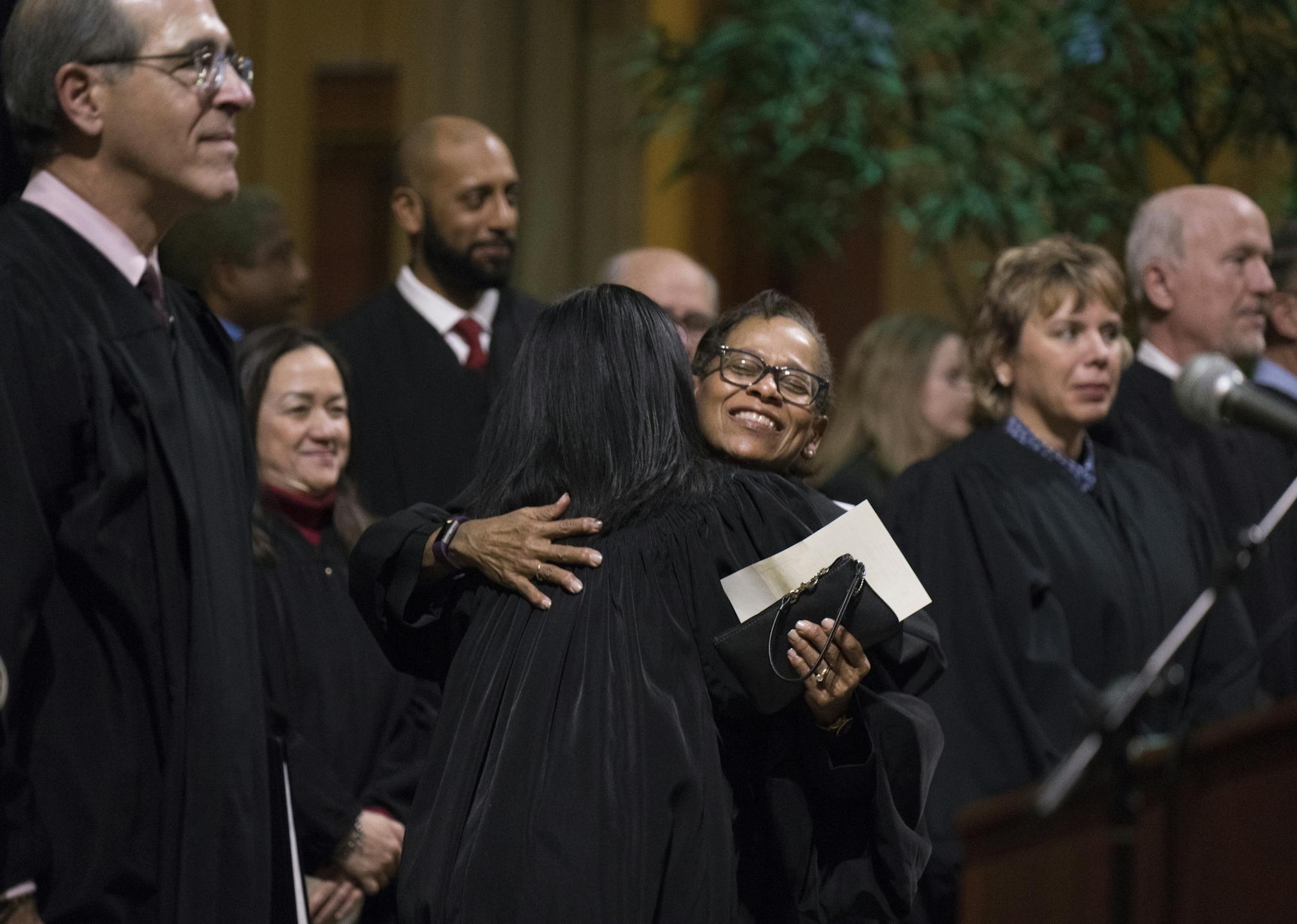 Judge Sophia Vuelo got a hug from Supreme Court Justice Natalie Hudson after the ceremony.