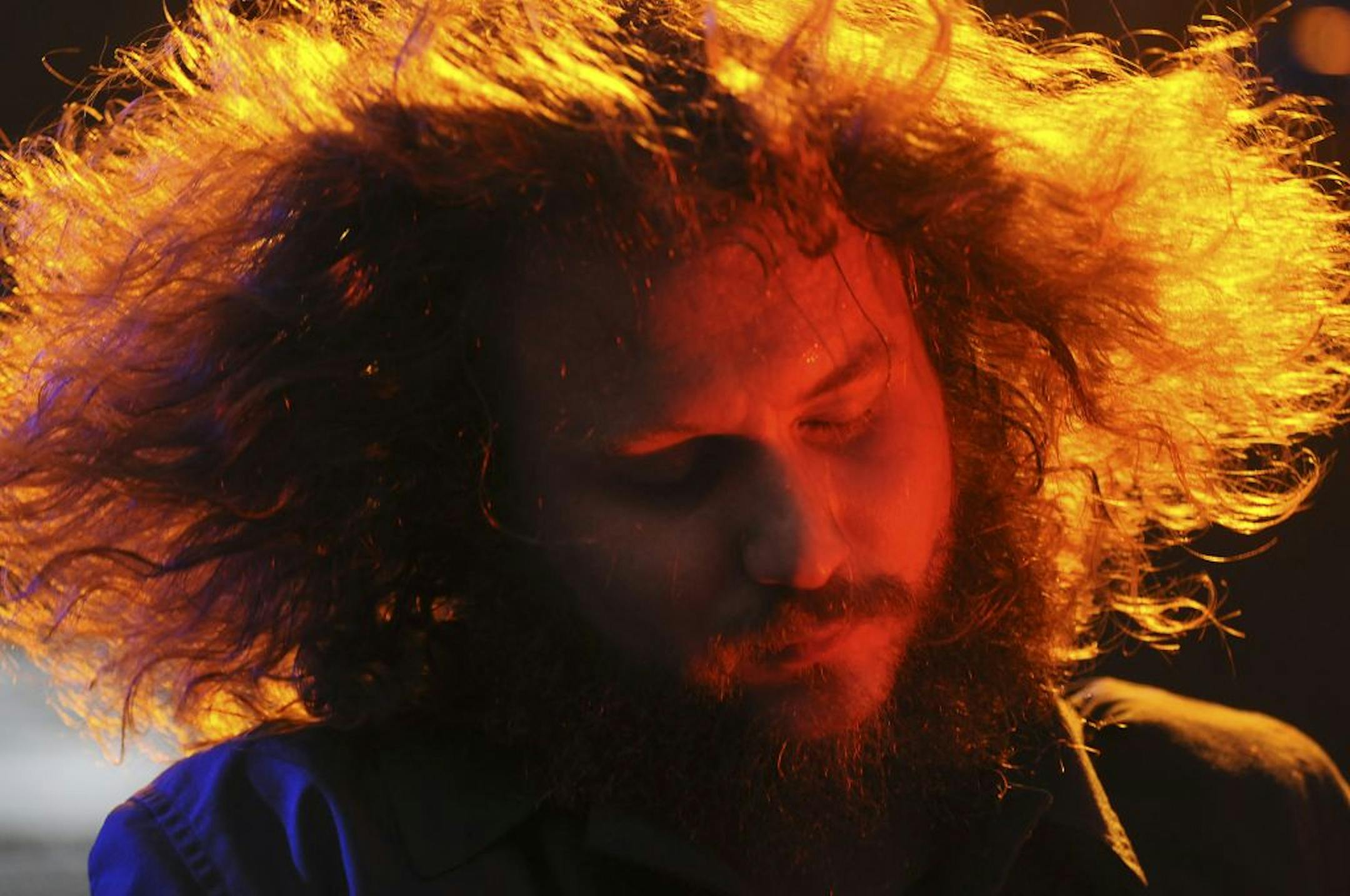 My Morning Jacket's lead singer, Jim James performed during Rock the Garden music festival at the Walker Art Center. Despite rainy weather, thousands of people turned up to enjoy a variety of bands.